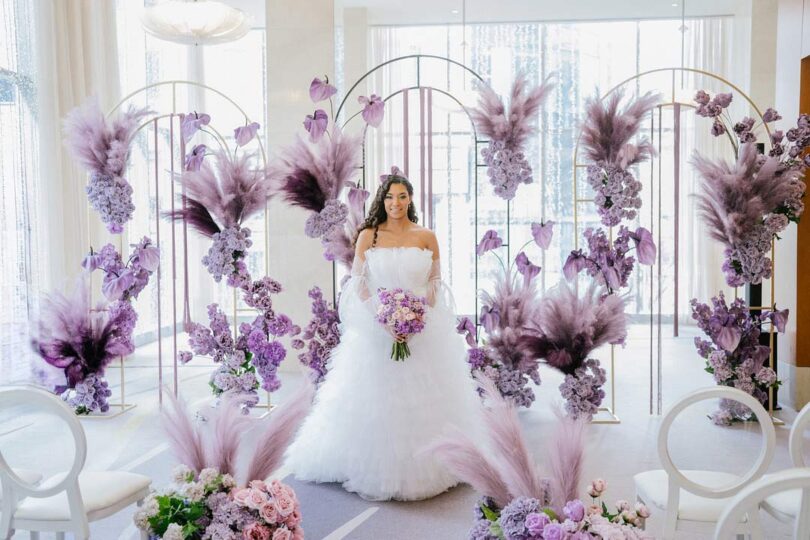 wedding ceremony with purple flowers